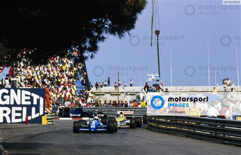 René Arnoux Ligier JS33 Ford leads Riccardo Patrese Williams FW12C