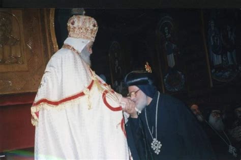 An Old Photo Of A Priest And A Man