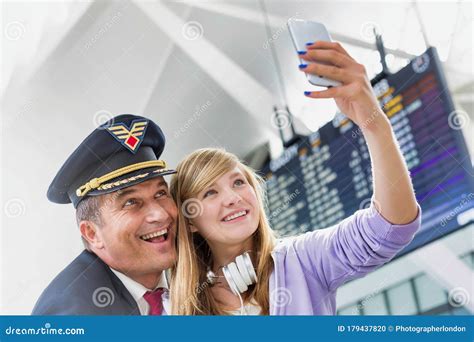 Young Beautiful Teenage Girl Taking Selfie with Mature Pilot in Airport Stock Photo - Image of ...