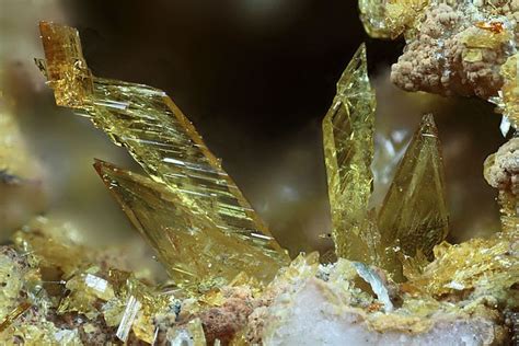 Some Very Pretty Yellow Crystals On Top Of Each Other In The Rocks And