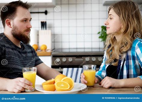 Couple Drinking Orange Juice Stock Photo Image Of Joyful Household