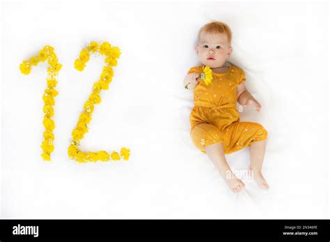 12-month-old baby girl. Baby milestone two months. Twelve month old baby Stock Photo - Alamy