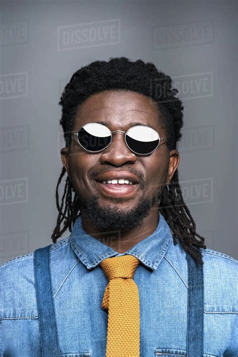 Smiling African American Man In Black Sunglasses Isolated On Gray