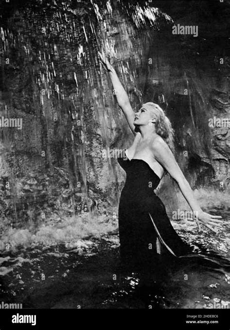 Anita Ekberg in the famous iconic Trevi Fountain scene from the film La ...