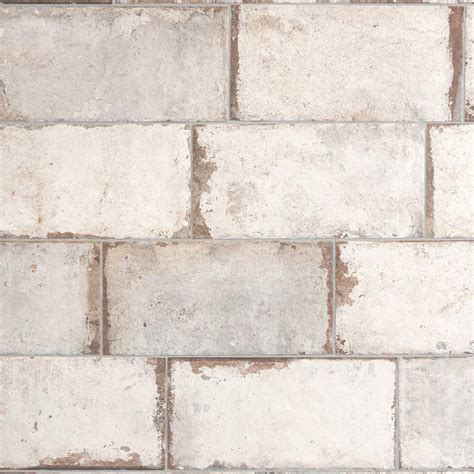 This White San Juan Blanco Porcelain Tile Is 8in X 16in With Stone