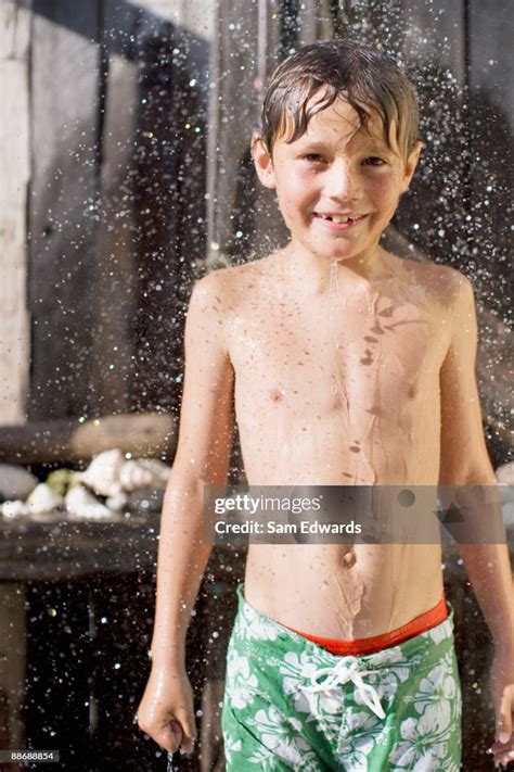 Boy Rinsing Off Outdoors High-Res Stock Photo - Getty Images