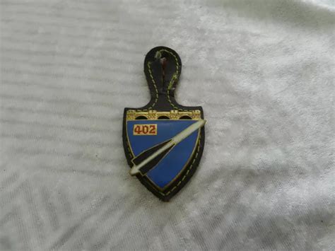 INSIGNE MILITAIRE ÉMAILLÉ 402 régiment d artillerie antiaérienne Drago