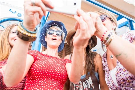 Premium Photo Low Angle View Of Women Taking Selfie