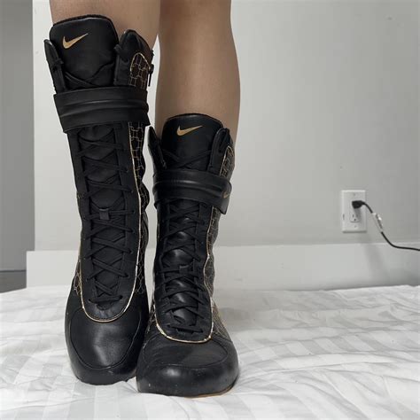 Nike Women's Black and Gold Boots | Depop