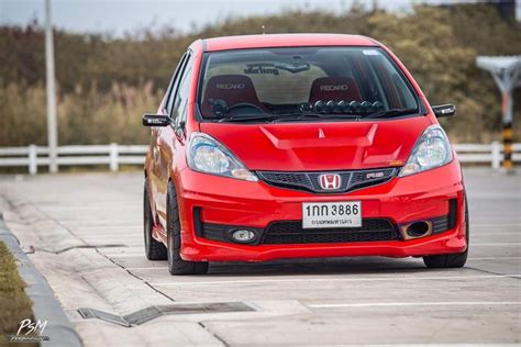 red honda civic driving   road