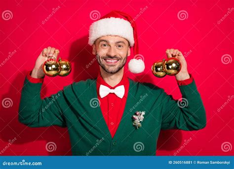 Photo Of Excited Pretty Man Wear X Mas Bowtie Green Cardigan Rising Hanging Pine Decorations