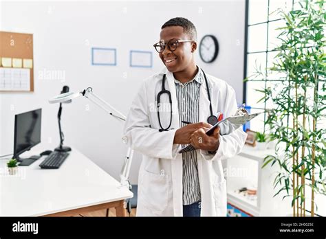 Young African Man Working As Doctor At Medical Clinic Stock Photo Alamy