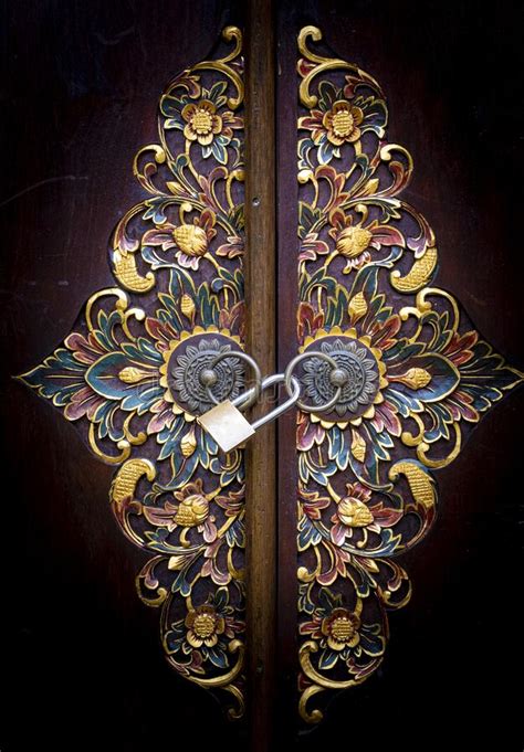 Balinese Intricate Wood Carved Doors With Brass Lock And Knobs Stock