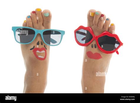 Happy and funny black summer feet with colorful nail polish and sunglasses Stock Photo - Alamy