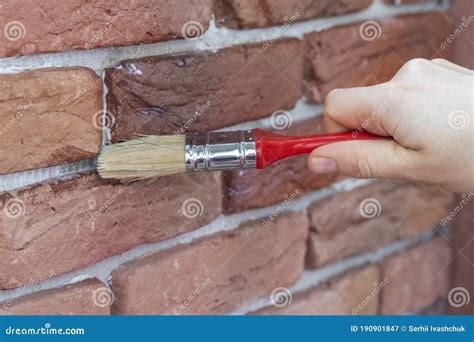 Process of Varnishing Grout between Gypsum Decorative Bricks. Covering ...