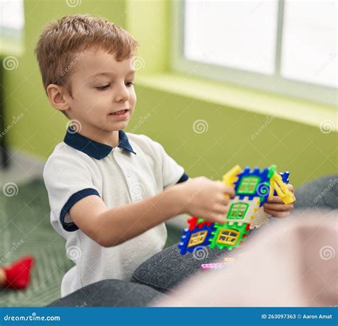 Adorable Toddler Sitting On Floor Playing At Home Stock Image Image