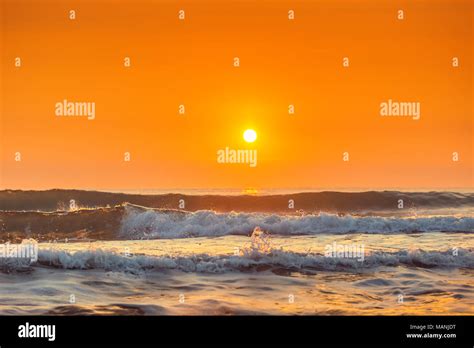 Sunrise And Shining Waves In Ocean Sunrise Shot Stock Photo Alamy