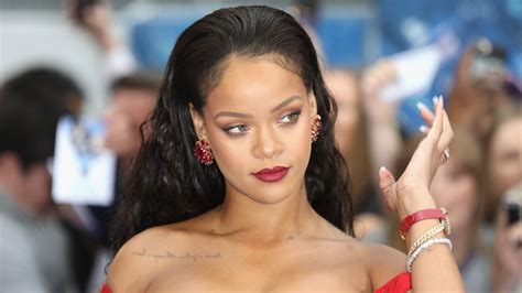 Rihanna Sizzles In Purple Lingerie As She Showcases Her Tattoos In