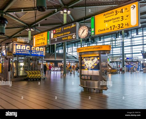 Signs in train station Schiphol Plaza of Schiphol Amsterdam Airport ...