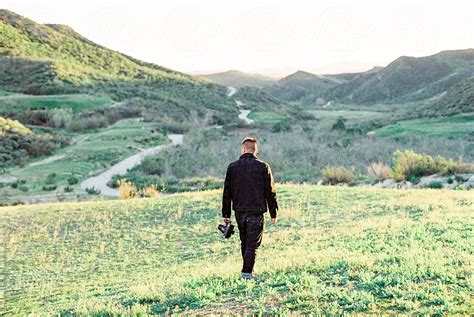 Man Walking In Hills By Stocksy Contributor Daniel Kim Photography