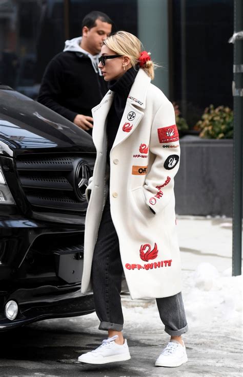 Hailey Baldwin Rocks a Bold Logo Coat With White Kicks in NYC ...