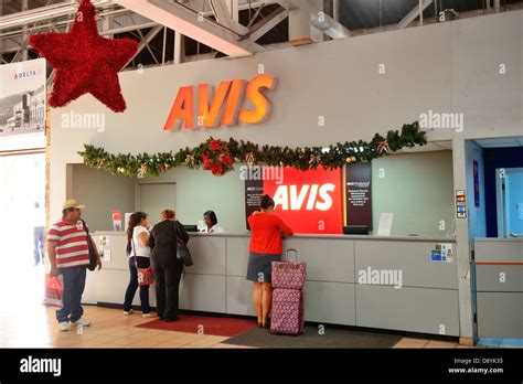 Car rental company counter at airport Stock Photo - Alamy