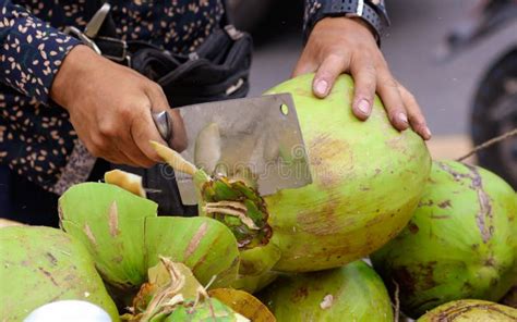 Coconut is Cut with a Knife for Drinking Milk Stock Photo - Image of ...