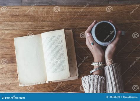 Reading a Book and Drinking Coffee in Cafe Stock Photo - Image of pages, hands: 118462428