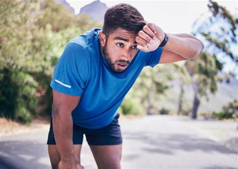 Premium Photo Man Tired And Sweating For Sports Training Exercise Break And Workout Challenge