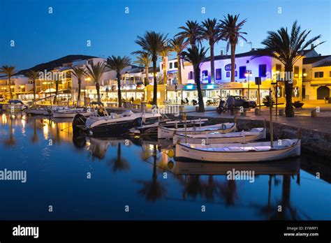 Restaurants at night along the harbour, Fornells, Menorca, Balearic ...