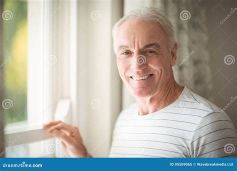 Senior Man Standing By Window Stock Image Image Of Life House 95509065