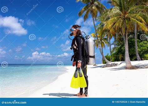 Female Scuba Diver Stands On A Tropical Beach Stock Photo Image Of