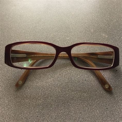 Versace frames Preloved Authentic Versace glasses frames. They're rectangular and a dark maroon ...