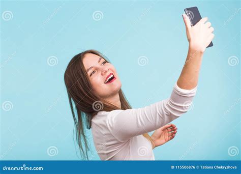 Young Woman Talking With Friend Through A Video Call On A Smartphone