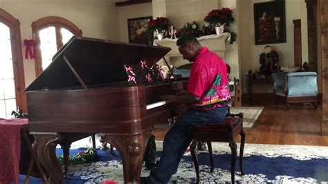 Kris Nicholson Practicing Rudolph The Red Nose Reindeer On A Steinway