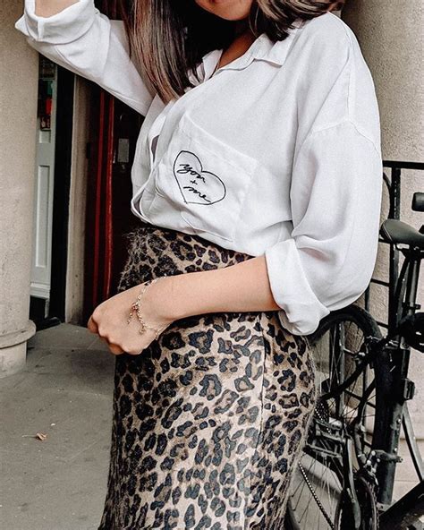 Woman With Leopard Print Skirt And Bike