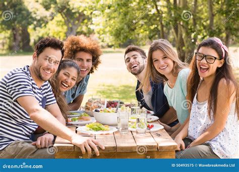 Happy Friends In The Park Having Lunch Stock Image Image Of Park