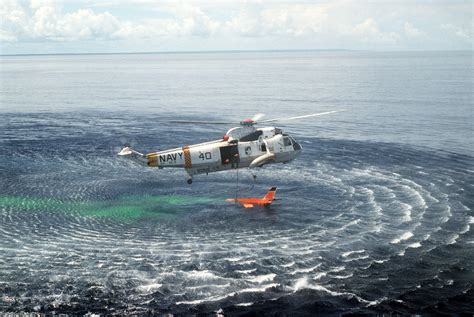 An Air To Air View Of An SH 3 Sea King Helicopter Attaching A Recovery