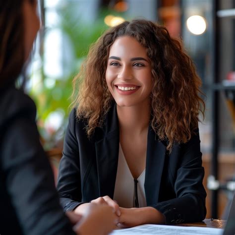 Premium Photo Smiling Female Manager Interviewing An Applicant In Office