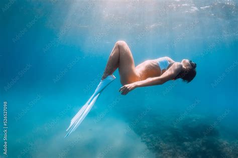 Freediver Lady In Bikini Relaxing And Glides With Fins Freediving And