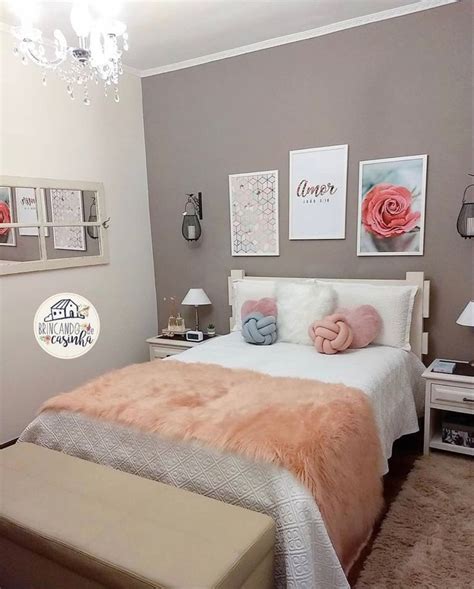 A Bedroom With Pink And Gray Decor On The Walls