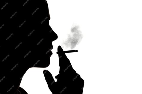 Premium Photo Close Up Of Silhouette Man Smoking Cigarette Against