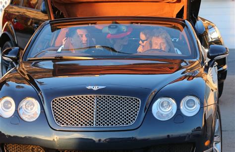 Photo Johnny Hallyday en voiture avec Thierry Chassagne le président