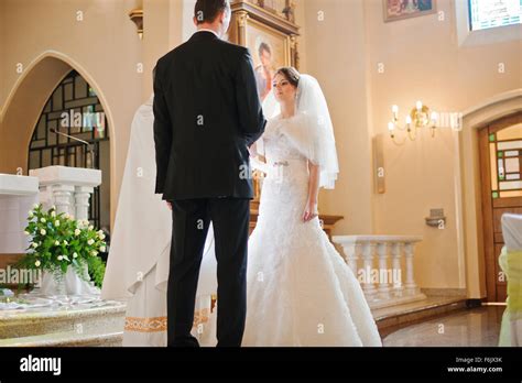 Christian Wedding Couple At Catholic Church Stock Photo Alamy