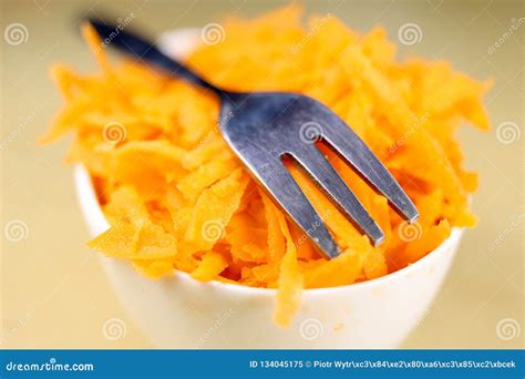 Fresh Carrot Grated On A Metal Kitchen Grate Vegetables Prepared For