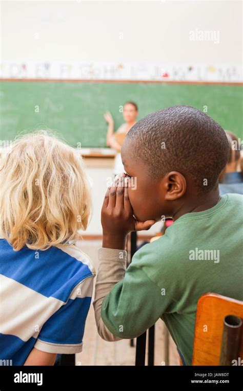 Students Whispering In Class