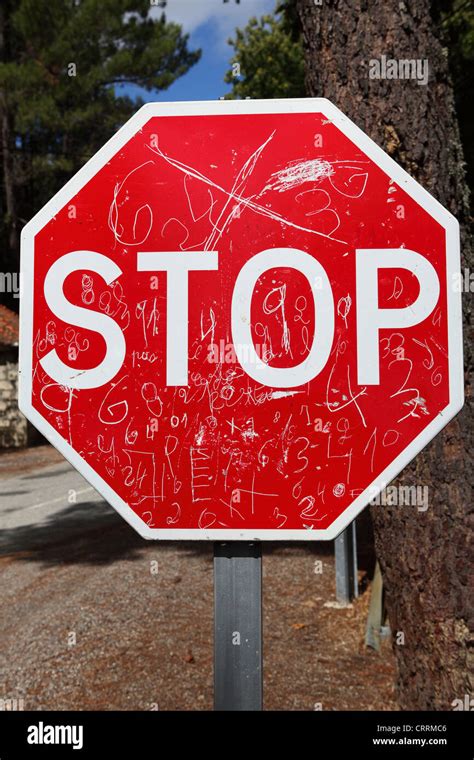 A graffiti marked Stop sign at Manteigas, Portugal Stock Photo - Alamy