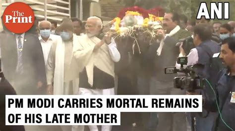 Pm Narendra Modi Carries The Mortal Remains Of His Mother Heeraben Modi