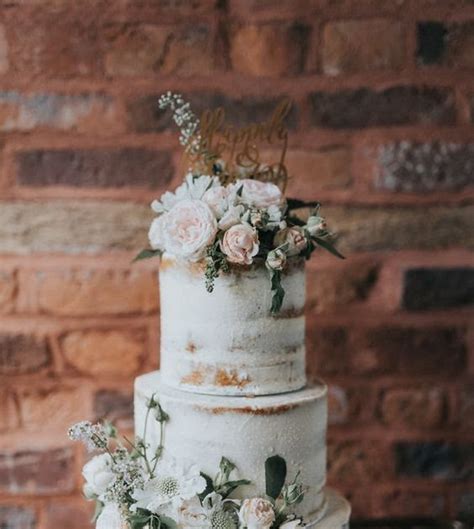 Elegant Bohemian Decor Semi Naked Wedding Cake With Flowers Outdoor Wedding Ceremony At The