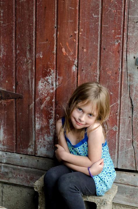 cute  girl sitting   rail stock photo image  white smile